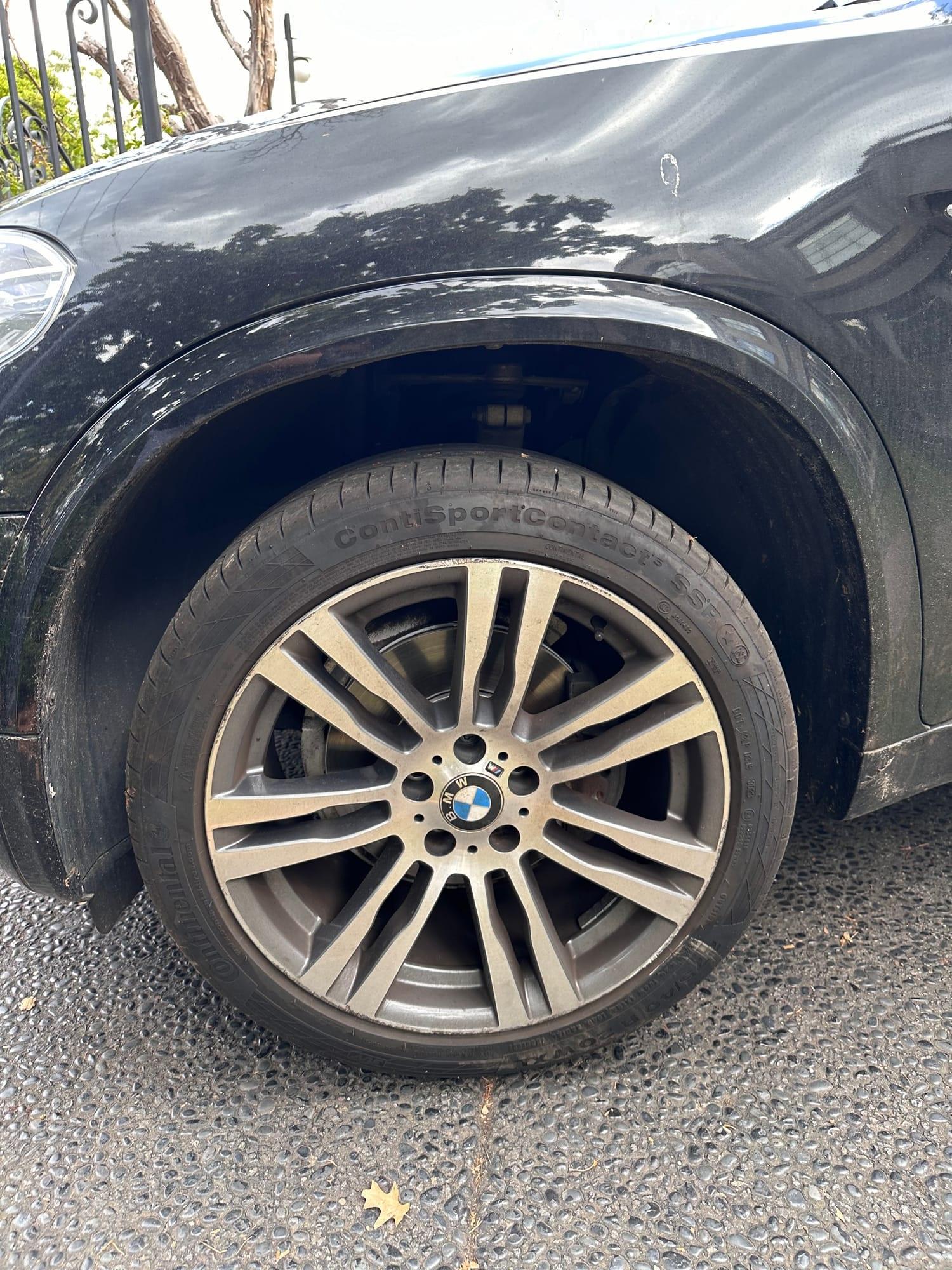 BMW X5 — front wheel and tyre before detailing