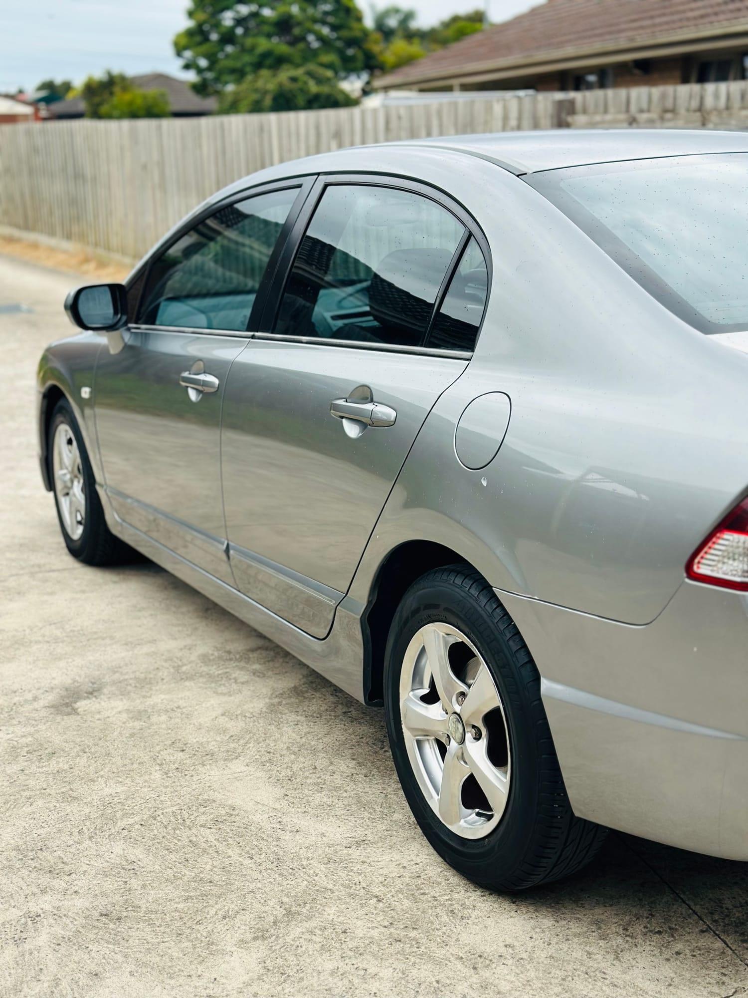 Honda Civic — side profile after exterior wash