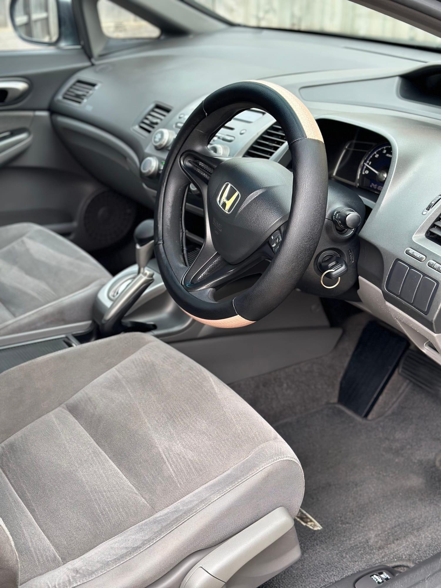 Honda Civic — driver's seat and dashboard, after detailing
