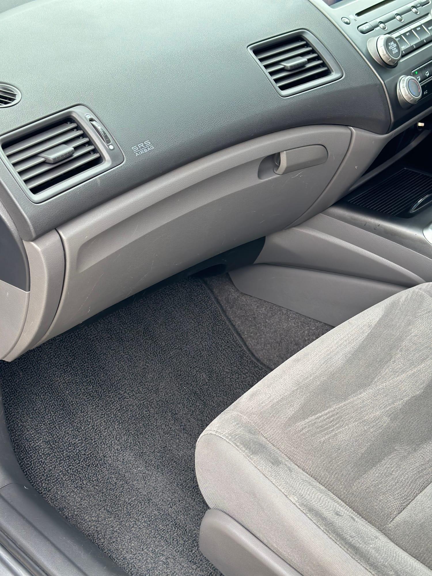 Honda Civic — passenger-side dash and carpet, after detailing