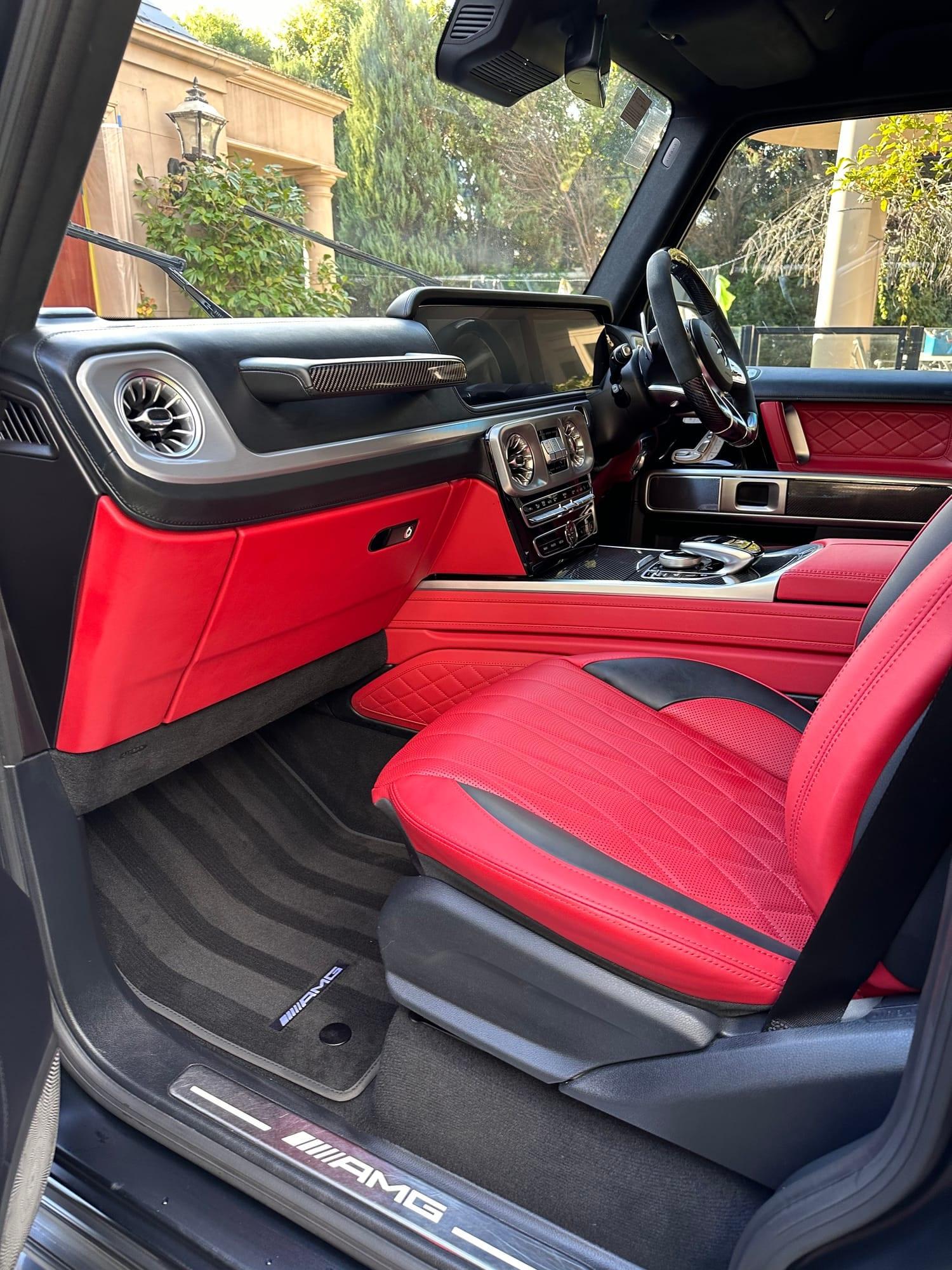Mercedes-AMG G63 — driver's side cabin, red nappa seat and carpets, after detailing