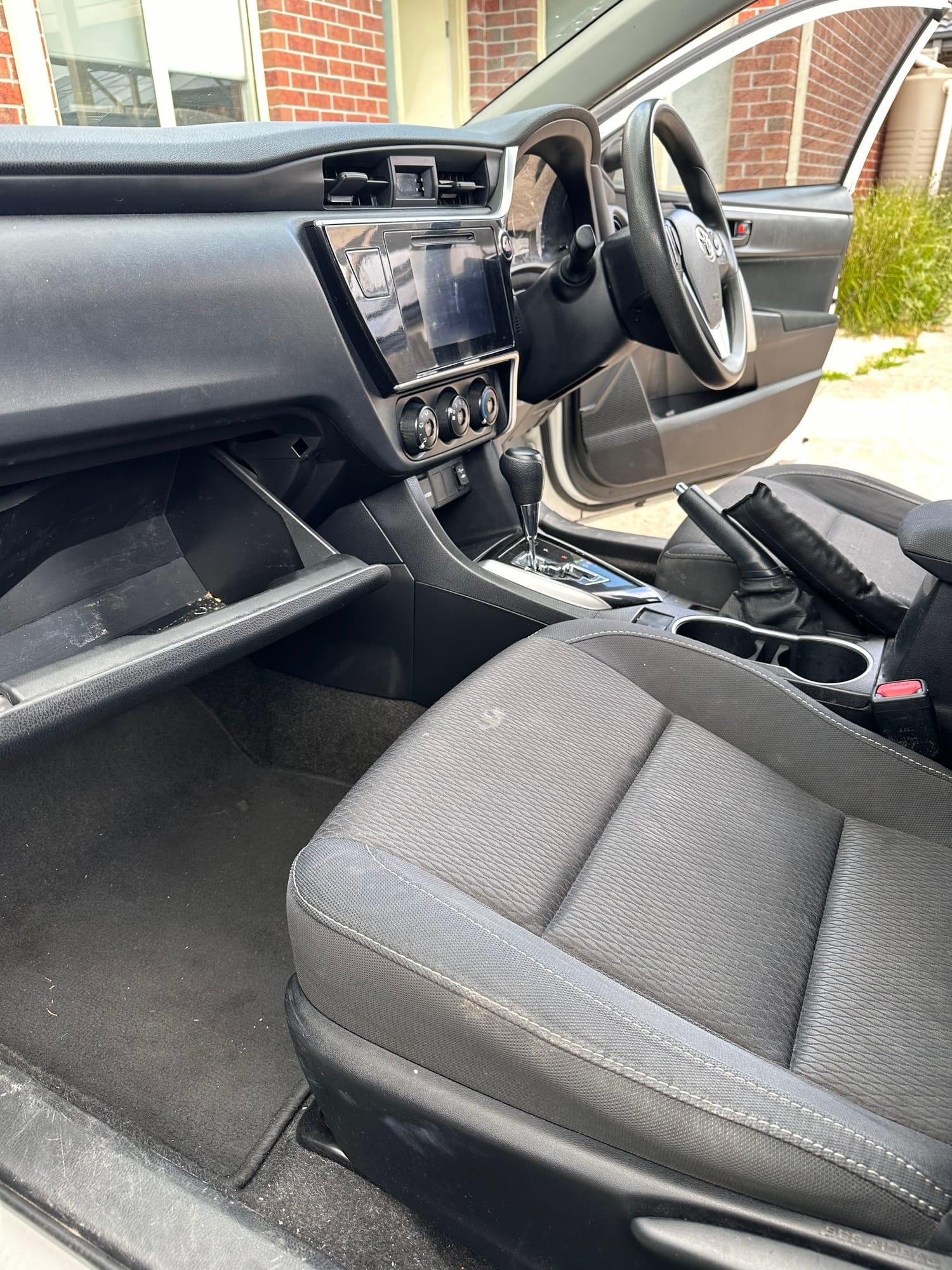 Toyota Corolla — driver's seat, dash and footwell, before detailing