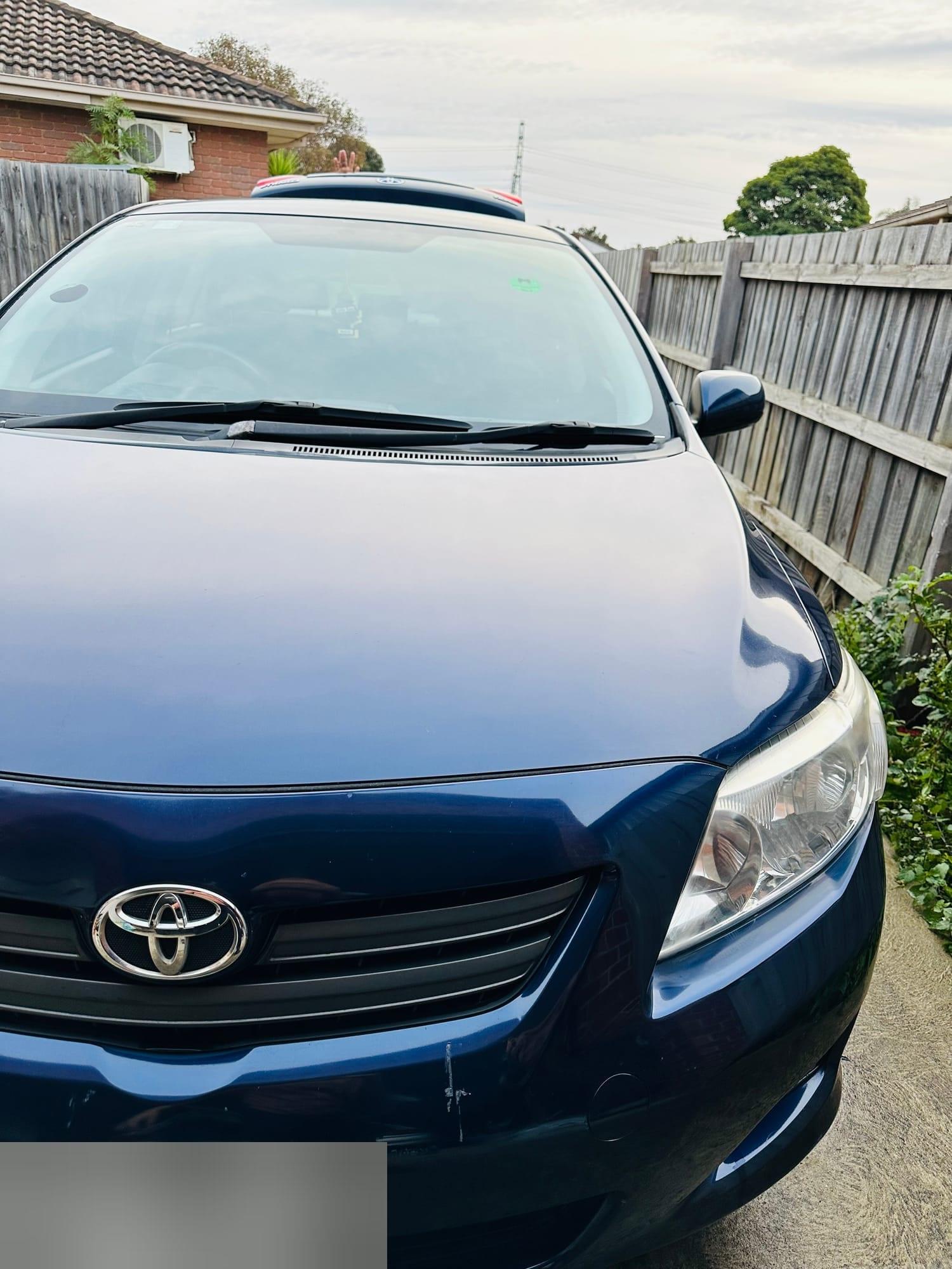 Toyota Corolla Sedan — front end after exterior wash