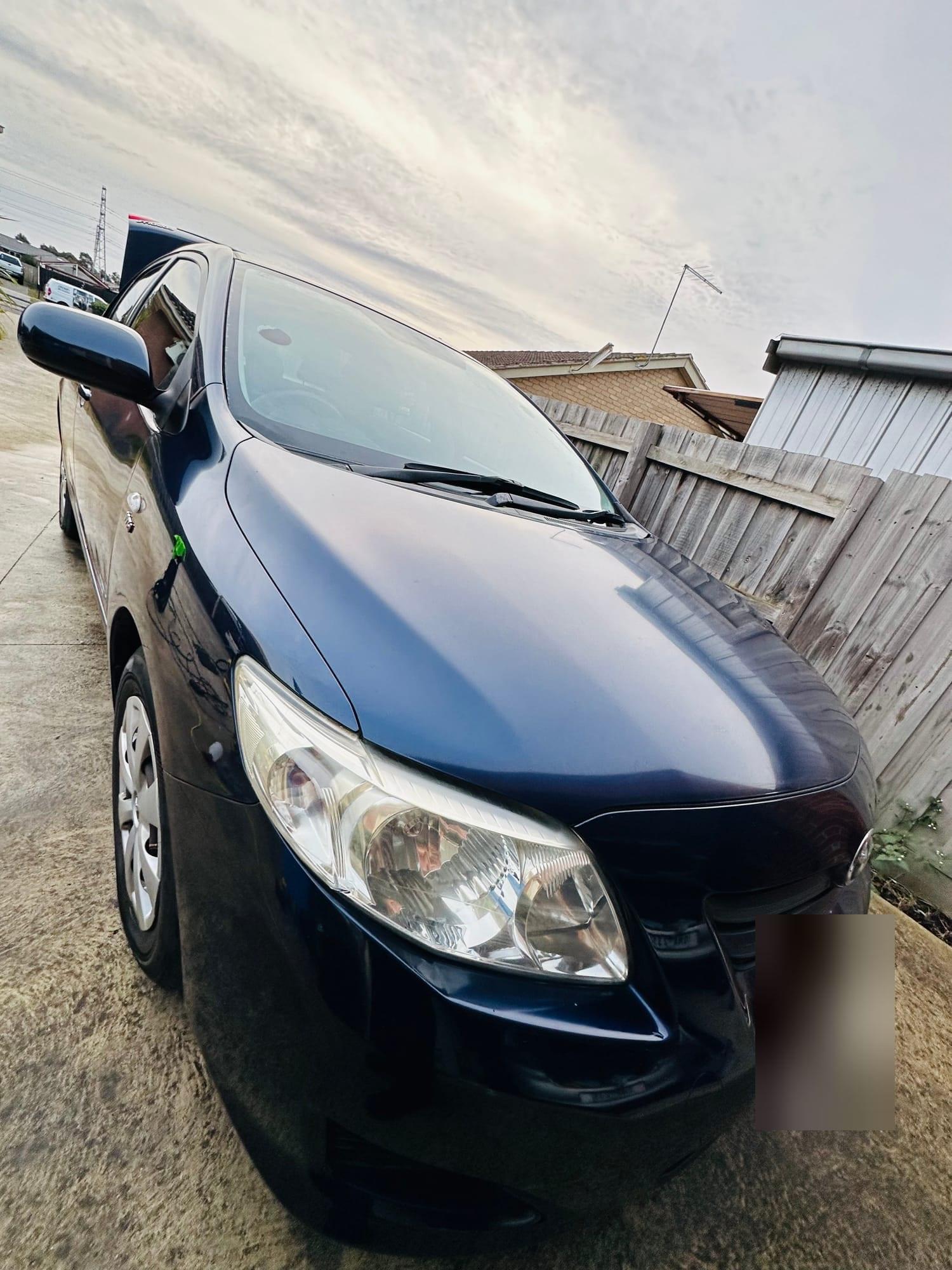 Blue Toyota Corolla sedan after detailing
