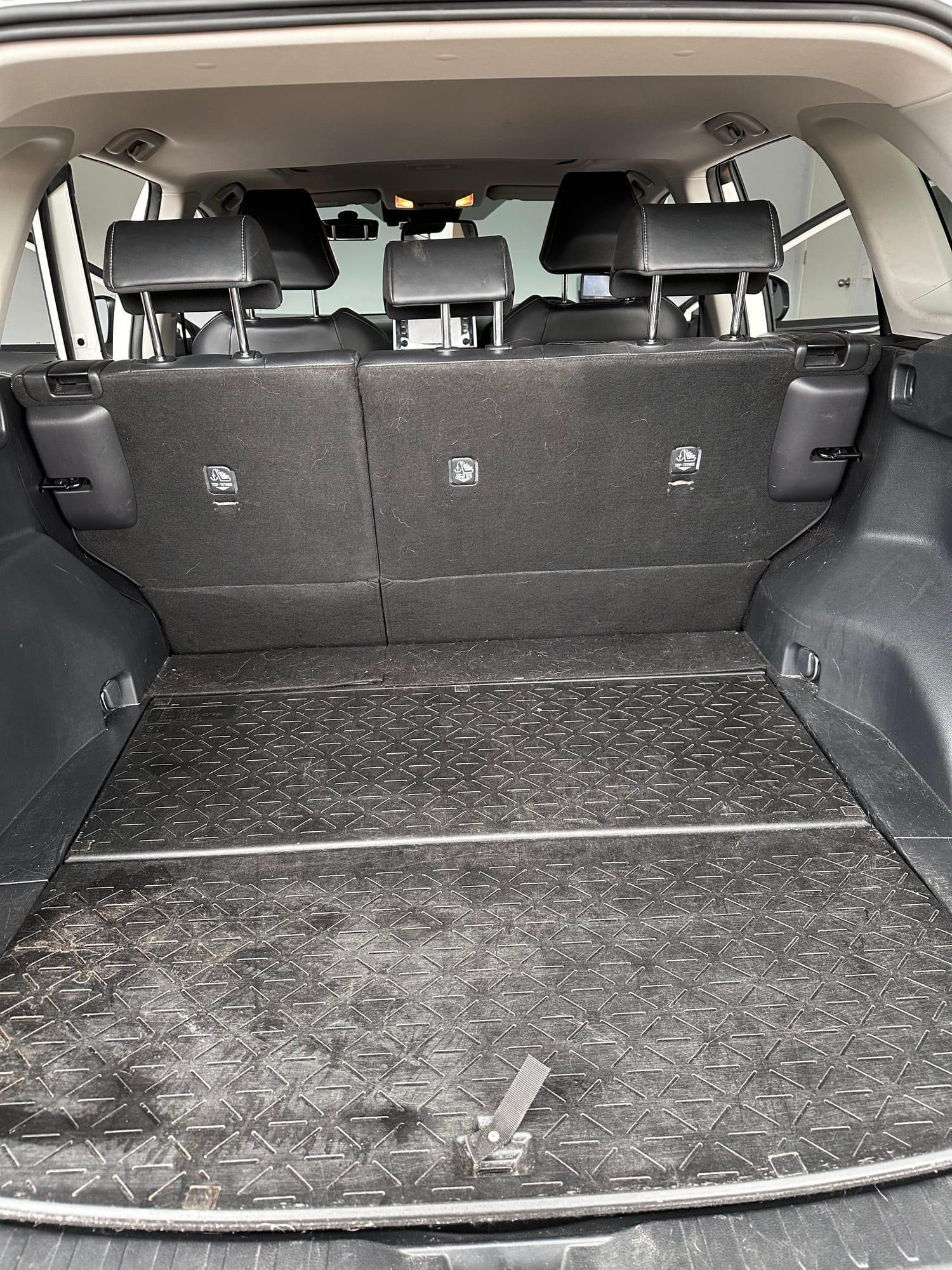 Toyota RAV4 — cargo liner before cleaning
