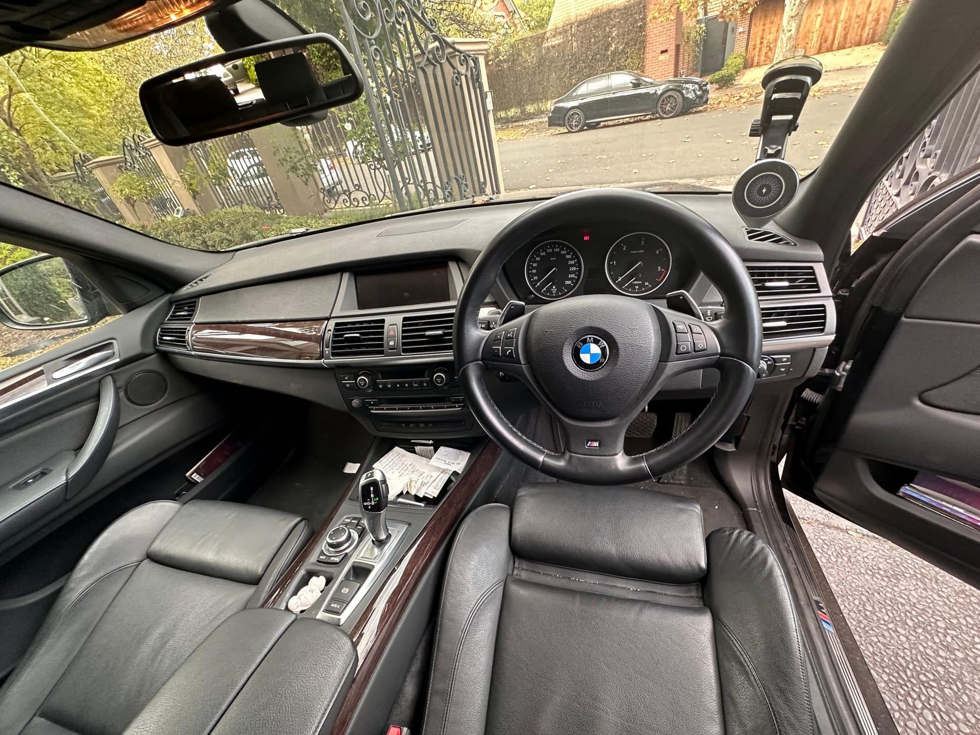 BMW X5 — driver's cabin, dash and steering wheel, before detailing