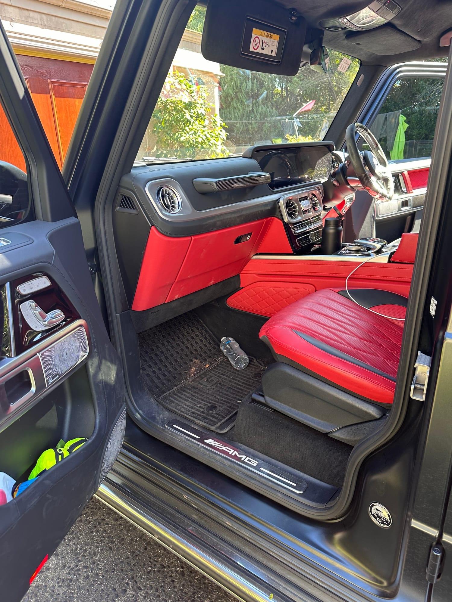 Mercedes-AMG G63 — driver's side cabin, red nappa seat and carpets, before detailing
