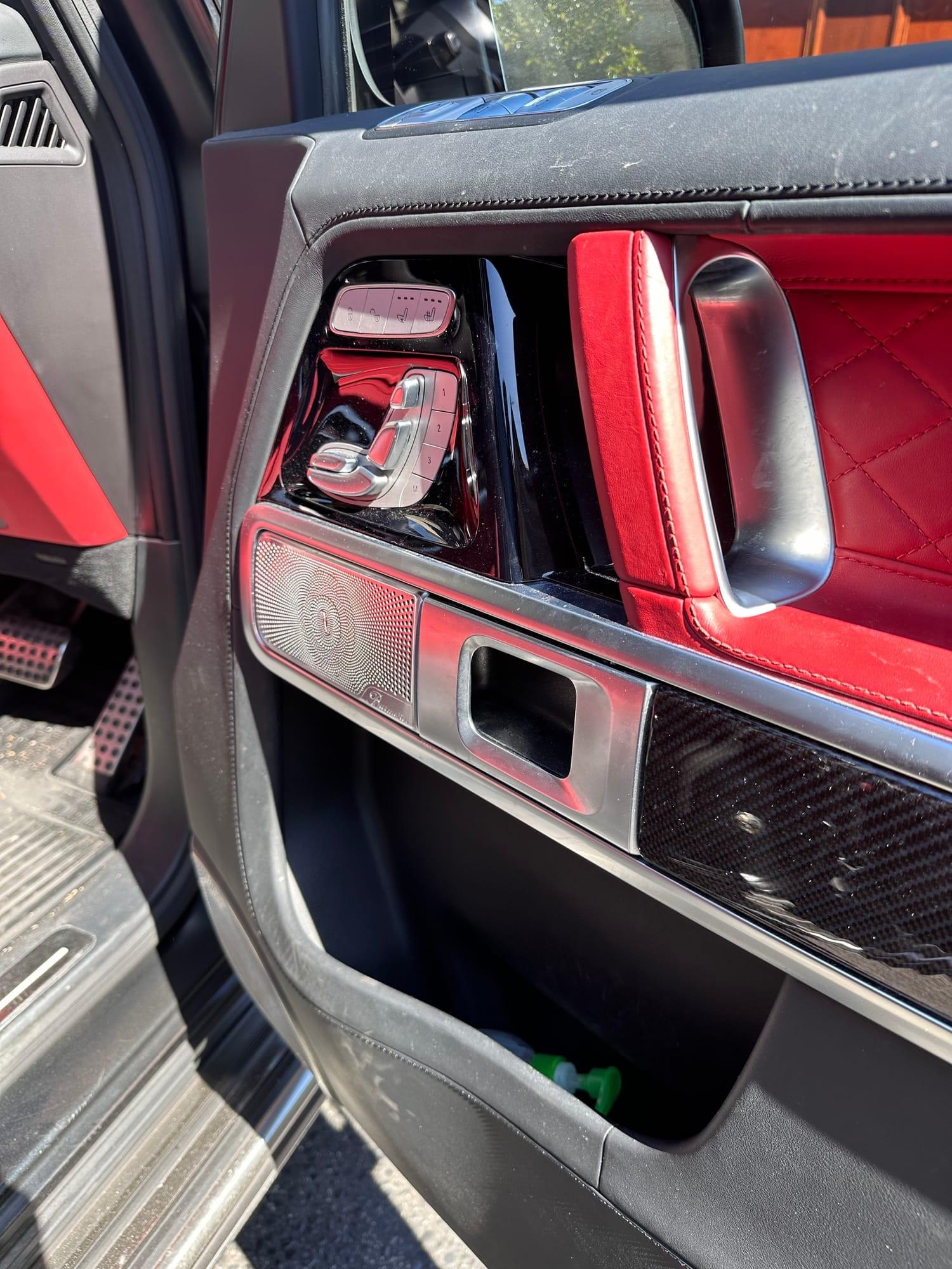 Mercedes-AMG G63 — driver's door card and carbon-fibre trim, before detailing